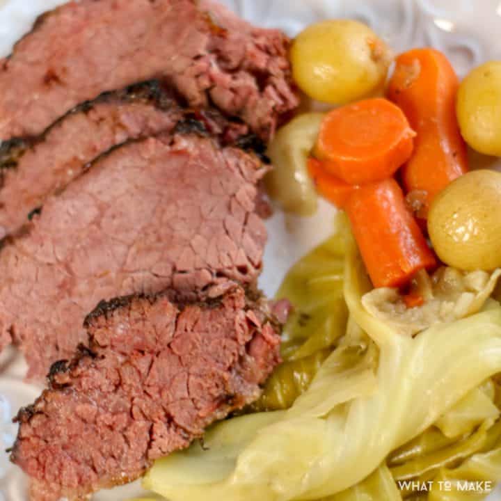 Close up image of a plate of corned beef and cabbage that has been cooked in a pressure cooker