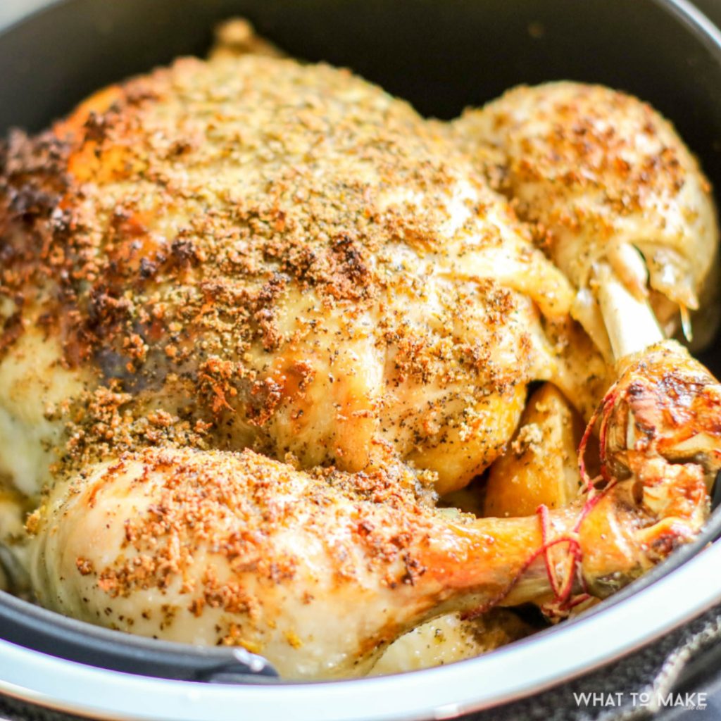 Image of a cooked lemon pepper chicken in a pressure cooker
